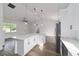 Kitchen featuring white cabinetry, stainless steel appliances, quartz island, and pendant lighting at 5 Willow Trl, Ocala, FL 34472