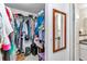 Organized walk-in closet with ample storage space, shelves, and hanging rods, offering a practical solution at 6127 Sw 84Th Place Rd, Ocala, FL 34476