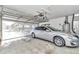 Spacious garage with an automatic door, ample lighting, and room for storage at 6127 Sw 84Th Place Rd, Ocala, FL 34476