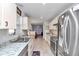 Stylish kitchen with stainless steel appliances, granite countertops, and ample cabinetry, perfect for cooking and entertaining at 6127 Sw 84Th Place Rd, Ocala, FL 34476