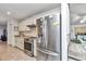 Well-lit kitchen with stainless steel refrigerator, matching appliances, and ample cabinet space at 6127 Sw 84Th Place Rd, Ocala, FL 34476