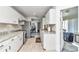 Spacious kitchen boasting stainless steel appliances, granite countertops, and tiled floors at 6127 Sw 84Th Place Rd, Ocala, FL 34476