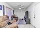Cozy living room with comfortable seating, ceiling fan, and neutral color palette at 6127 Sw 84Th Place Rd, Ocala, FL 34476