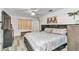 Spacious main bedroom with a king bed, modern decor, and a large window, creating a relaxing retreat at 6127 Sw 84Th Place Rd, Ocala, FL 34476