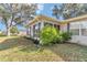 The screened-in porch has views of the backyard and surrounding trees at 6127 Sw 84Th Place Rd, Ocala, FL 34476