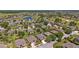 Panoramic aerial shot showcases a neighborhood with lakes, golf courses, and mature trees in a beautiful landscape at 7432 Sw 98Th Ave, Ocala, FL 34481