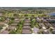 A sprawling community with manicured lawns, mature trees, and a beautiful golf course and lake at 7432 Sw 98Th Ave, Ocala, FL 34481