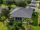 Aerial view of the property showcasing its roof, landscaping, and prime corner lot location at 7432 Sw 98Th Ave, Ocala, FL 34481