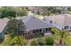 Aerial view of home featuring screened-in lanai and mature landscaping at 7432 Sw 98Th Ave, Ocala, FL 34481