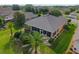 Aerial view of home with screened in porch, mature landscaping, and a meticulously maintained yard at 7432 Sw 98Th Ave, Ocala, FL 34481