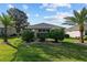 Spacious backyard with lush lawn and mature trees offering shade and privacy at 7432 Sw 98Th Ave, Ocala, FL 34481