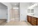 Bathroom with a glass-enclosed shower and a double vanity at 7432 Sw 98Th Ave, Ocala, FL 34481