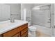 Bathroom featuring tile flooring, a glass shower, vanity and a toilet at 7432 Sw 98Th Ave, Ocala, FL 34481
