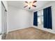 Carpeted bedroom with a window, ceiling fan, closet, and natural light at 7432 Sw 98Th Ave, Ocala, FL 34481