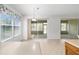 Bright dining area with sliding glass doors to a screened-in porch at 7432 Sw 98Th Ave, Ocala, FL 34481
