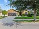 Lovely single-story home features mature landscaping, a long driveway, and a two-car garage at 7432 Sw 98Th Ave, Ocala, FL 34481