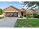 Charming single-story home featuring a well-maintained lawn and a two-car garage at 7432 Sw 98Th Ave, Ocala, FL 34481
