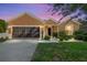Charming single-story home featuring a well-maintained lawn and a two-car garage at 7432 Sw 98Th Ave, Ocala, FL 34481