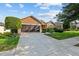 Lovely single-story home features mature landscaping, a long driveway, and a two-car garage at 7432 Sw 98Th Ave, Ocala, FL 34481