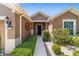 Inviting home entrance with manicured landscaping, leading to a secure, stylish front door at 7432 Sw 98Th Ave, Ocala, FL 34481