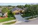 Lovely home features a well-maintained front yard, mature trees, and a paved driveway at 7432 Sw 98Th Ave, Ocala, FL 34481