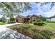 Charming single-story home features manicured lawn, neat shrubbery, and a functional two-car garage at 7432 Sw 98Th Ave, Ocala, FL 34481
