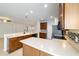 Bright kitchen featuring wood cabinets, stainless steel appliances, and breakfast bar at 7432 Sw 98Th Ave, Ocala, FL 34481