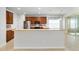Well-equipped kitchen offers a breakfast bar, stainless steel appliances and plenty of cabinet storage at 7432 Sw 98Th Ave, Ocala, FL 34481