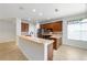 Bright kitchen boasts stainless appliances, a breakfast bar and tile backsplash at 7432 Sw 98Th Ave, Ocala, FL 34481