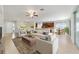 Spacious living room featuring tile floors, comfortable seating, and abundant natural light at 7432 Sw 98Th Ave, Ocala, FL 34481