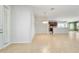 Bright, open-concept living room flows into the kitchen, showcasing tile floors and neutral walls at 7432 Sw 98Th Ave, Ocala, FL 34481