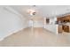 Open living room floor plan with tiled floors connecting the kitchen and entry way at 7432 Sw 98Th Ave, Ocala, FL 34481