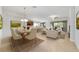 Open-concept living space with dining area and breakfast bar for modern, relaxed living at 7432 Sw 98Th Ave, Ocala, FL 34481