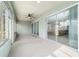 Sunroom with large sliding glass doors and a ceiling fan at 7432 Sw 98Th Ave, Ocala, FL 34481