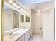 Bright bathroom features a double sink vanity with plenty of counter space and storage, along with a toilet at 8051 Sw 115 Loop, Ocala, FL 34481