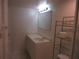 Bathroom featuring a white vanity, mirror and shelving unit at 8132 Fairways Cir # R103, Ocala, FL 34472