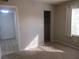 Carpeted bedroom featuring a walk-in closet and natural light from a window at 8132 Fairways Cir # R103, Ocala, FL 34472