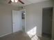 Carpeted bedroom with closet and view to other rooms at 8132 Fairways Cir # R103, Ocala, FL 34472