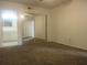 Bedroom featuring mirrored closet doors, carpeted floor, and en-suite bathroom at 8132 Fairways Cir # R103, Ocala, FL 34472