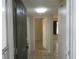 Inviting foyer with neutral tile flooring, fresh paint and easy access to all parts of the home at 8132 Fairways Cir # R103, Ocala, FL 34472