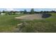 Golf course sand trap with lush green grass and trees in the background at 8132 Fairways Cir # R103, Ocala, FL 34472