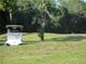 Scenic golf course with a golf cart on the path, showcasing lush greenery at 8132 Fairways Cir # R103, Ocala, FL 34472