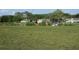 Scenic golf course view with golfers, golf cart, and lush green surroundings at 8132 Fairways Cir # R103, Ocala, FL 34472