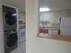 The kitchen features white appliances, tile floors, and wood cabinets at 8132 Fairways Cir # R103, Ocala, FL 34472