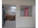 The kitchen features white appliances, tile floors, and wood cabinets at 8132 Fairways Cir # R103, Ocala, FL 34472