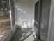 Screened patio overlooking the yard and surrounding trees at 8132 Fairways Cir # R103, Ocala, FL 34472