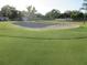 Beautiful golf course featuring a generous sand trap at 8132 Fairways Cir # R103, Ocala, FL 34472