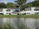 Charming lakeside condominiums with beautiful lawns and calming waters at 8132 Fairways Cir # R103, Ocala, FL 34472