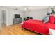 Relaxing bedroom with wood floors, a ceiling fan, and neutral wall color at 8625 Sw 94Th Ln # D, Ocala, FL 34481