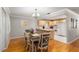 Open dining area connected to the kitchen, featuring a wooden table, chairs, and stylish decor at 8625 Sw 94Th Ln # D, Ocala, FL 34481